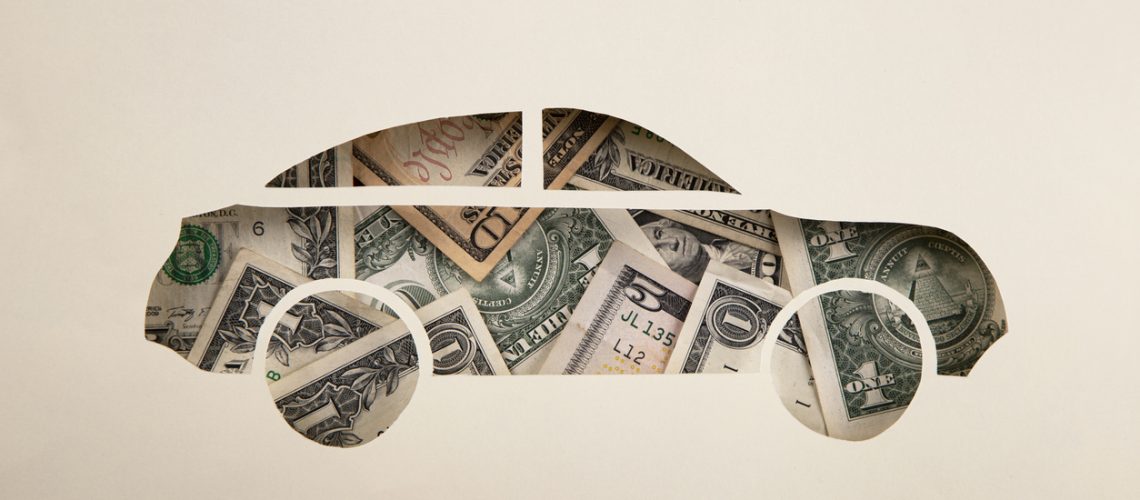 Car made of paper and American Dollar Banknotes