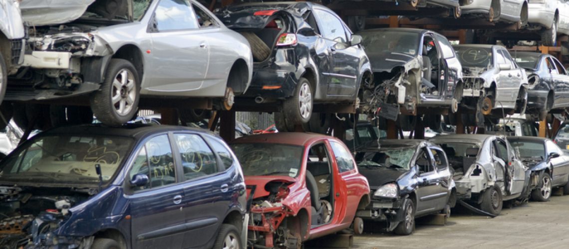 Rows of scrap cars awaiting recycling